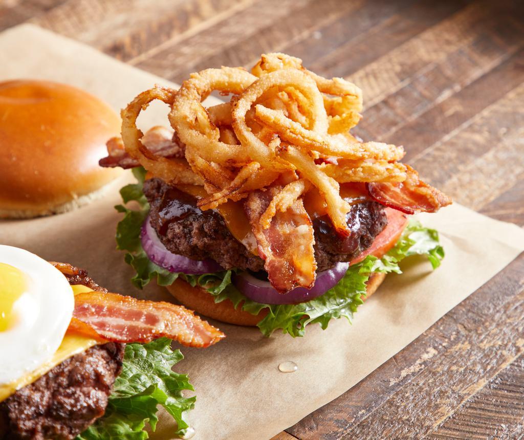 BBQ Bacon Burger · Guinness BBQ sauce, cheddar cheese, applewood bacon, onion tanglers, lettuce and tomatoes.