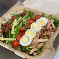 Smoked Chicken Cobb Salad · Spring mix, pulled chicken, red onion, tomato, bacon, egg, blue cheese crumbles, and avocado...