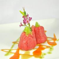 Tuna Dumpling · Avocado,wasabi caviar, scallion wrapped with tuna served with scallion truffle oil and wasab...