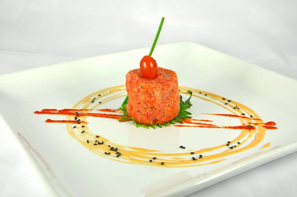 Spicy Salmon Tartar · Diced salmon served with spicy mayonnaise.