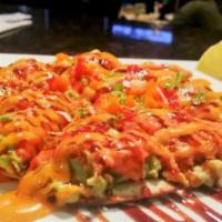 Tuna Sushi Pizza · Bottom: kani, avocado, seaweed salad, top with mango, spicy tuna with spicy mayo, and eel sa...