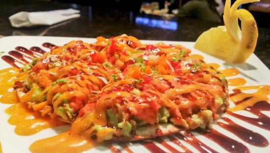 Tuna Sushi Pizza · Bottom: kani, avocado, seaweed salad, top with mango, spicy tuna with spicy mayo, and eel sauce.
