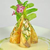 Chilean Sea Bass Spring Roll · Chilean sea bass, scallop, shrimp and vegetable wrapped in crispy spring roll, served with p...