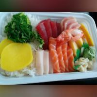 Chirashi Sushi · Assorted sashimi on a bed of sushi rice. Served with a side.