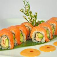Sunrise Roll · Salmon tempura and avocado topped with fresh salmon served with spicy mayo and eel sauce.