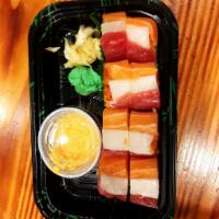 Hako Sushi Roll · Osaka style pressed sushi with crunchy spicy tuna and avocado topped with tuna, salmon and w...