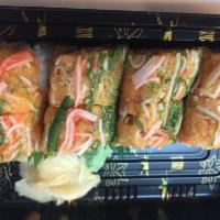 Ichiban Roll · Eel and avocado topped with spicy tuna, salmon, yellowtail, seaweed salad, kani and crunchy ...