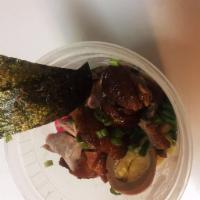 Roasted Duck Ramen · Served with corn, seaweed, bamboo shoot, scallions, naruto fish cakes, enoki mushroom and ba...