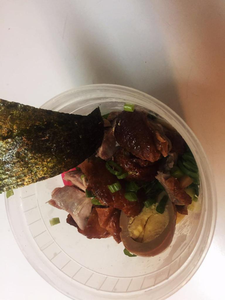 Roasted Duck Ramen · Served with corn, seaweed, bamboo shoot, scallions, naruto fish cakes, enoki mushroom and baby bok choy.