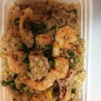 Seafood Fried Rice · Served with a side.