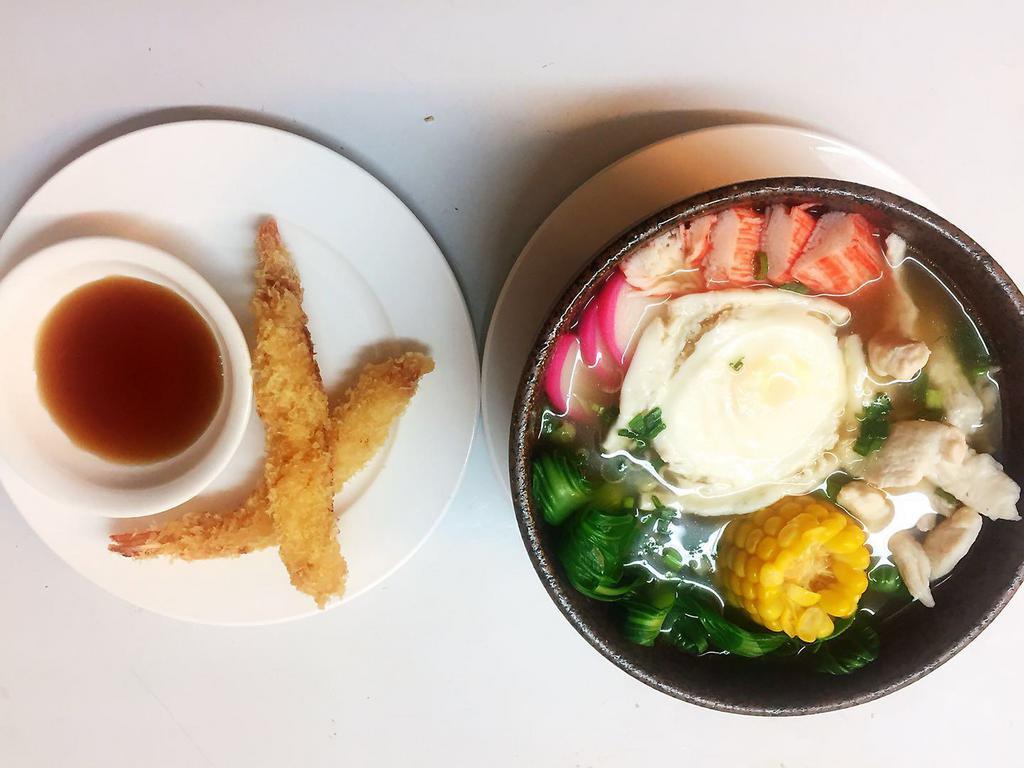 Nabeyaki Udon · Chicken and egg udon noodle soup with 2 tempura shrimp on the side. Served with a side.