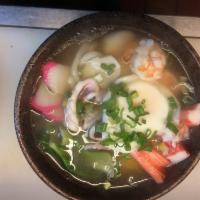 Seafood Udon · Scallop, clam, squid, shrimp and egg udon noodle soup. Served with a side.
