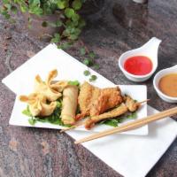 Orchid Trio · 2 Crab Cheese Wontons I 1 Egg Roll I 1 Fried Shrimp I 1 Chicken Wing I 1 Chicken Skewer I Sw...