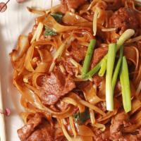 Drunken Noodles · Stir-fried wide rice noodles with spicy chili sauce, basil leaves, bean sprouts, red onion a...