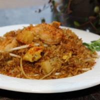Thai Fried Rice · Shrimp. pineapple, bean sprouts, onions and scallions stir-fried in curry sauce and chili po...