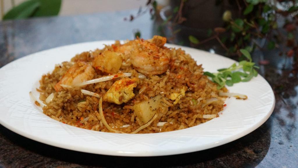 Thai Fried Rice · Shrimp. pineapple, bean sprouts, onions and scallions stir-fried in curry sauce and chili powder.