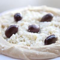 Greek Hummus · Mashed garbanzo beans mixed with tahini sauce, garlic and lemon juice. Topped with feta chee...