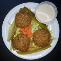 Falafel · 4 pieces. Mashed garbanzo and fava beans mixed with spices. Served with tahini sauce.