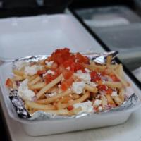 Greek Fries · Topped with feta cheese, red onion and tomato.