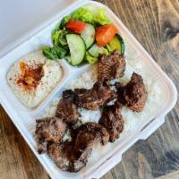 Beef Kabob Plate · Grilled chunks of beef. Served with hummus, rice and salad.