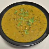 59. Daal Makhani · Black lentils. Served with rice.