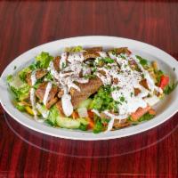 Gyro Salad · Lettuce, tomatoes, cucumber, onions and parsley mixed with our egyptian dressing. Roasted be...