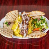 Shish Kabab Plate · Hummus, rice, veggie salad, pita bread, garlic and tahini sauce. Beef, lamb or chicken charb...