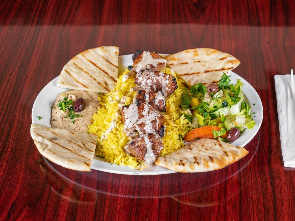 Shish Kabab Plate · Hummus, rice, veggie salad, pita bread, garlic and tahini sauce. Beef, lamb or chicken charbroiled chunks of marinated tenderloin.