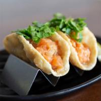 Salmon Poke Tacos (2 pcs.) · JINYA's original salmon poke in a crispy wonton taco shell topped with cilantro. 2 pieces.