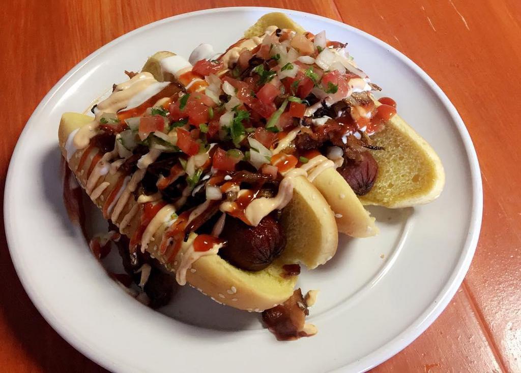La Street Dog · Sausage link wrapped in bacon topped with pico de gallo, aioli and ketchup.