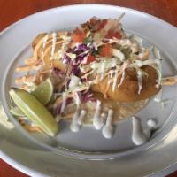 Fish Taco  · 1 piece. Fish served on a warm corn tortilla topped with cabbage our signature aioli, sour c...