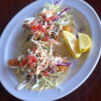 Shrimp Taco  · 1 piece. Battered shrimp served on a warm corn tortilla topped with cabbage our signature ai...