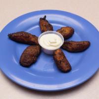Platanos Fritos con Lechera · Fried plantains with sweetened condensed milk.