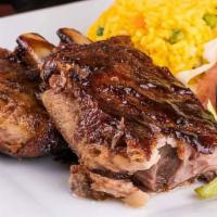 Costilla / BBQ Ribs  · Barbecue Ribs served with 2 sides.