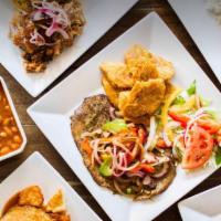 Bistec Encebollado / Steak and Onions  · Grilled steak and onions based in sazon served with two sides 