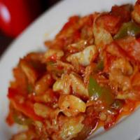 Bacalao / Cod Fish · Sautéed cod fish with peppers and onions served with two sides 