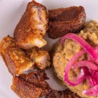 Chicharron Mofongo  / Pork · Fried pork mashed into green plantains with garlic, olive oil, and other seasonings.