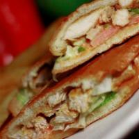 Sandwich de Pollo / Chicken  · Chicken sandwich made with seasoned chicken breasts. Served with lettuce and tomatoes. 
