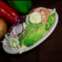 Ensalada Verde / Green Salad · Classic Green Garden salad. With lettuce, cucumbers, tomatoes, and cabbage. Add avocado for ...
