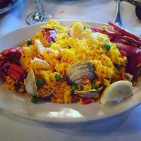 Paella Marinera · Lobster, shrimp, scallops, clams, mussels, cooked with saffron rice.