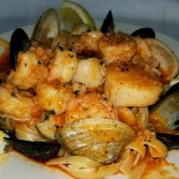 Seafood Over Pasta · Shrimp, scallops, clams, mussels & choose 1 of our signature sauces.