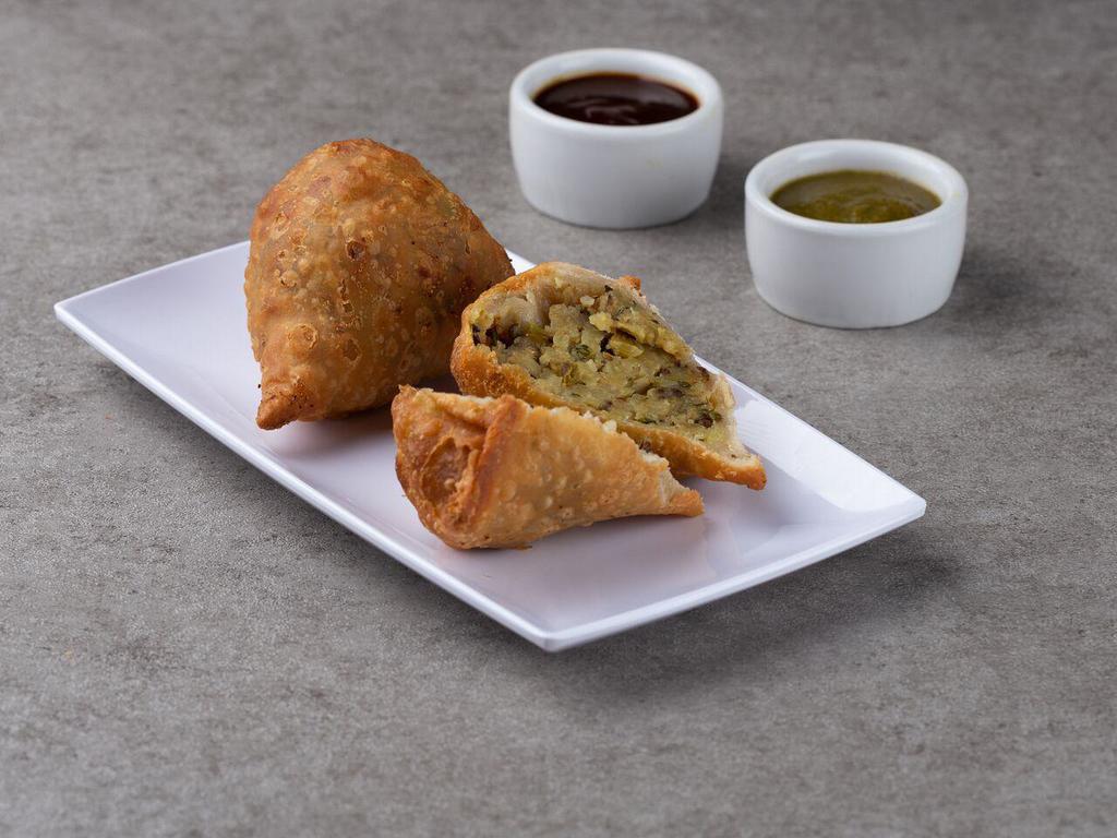 3. Vegetables Samosa · 2 piece. Deep fried pastry stuffed with spices potatoes and green peas. Served with tamarind chutney.