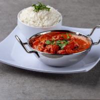 76. Lamb Curry · Boneless lamb cooked in onion and tomato sauce with Himalayan herbs and spices.