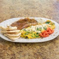 Greek Omelette · Served with hash browns and pita bread.