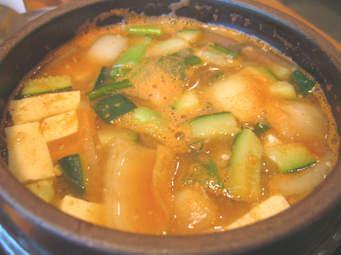 72. Soy Bean Jjigae · Tofu and vegetables in soy bean soup. Choice of the meat.