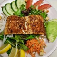 Salmon Salad · Grilled salmon served on top of our organic greens salad. 49 grams of protein, 3 grams of fi...