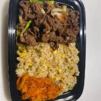 Bulgogi Cupbop · Marinated Beef Bulgogi on top of egg fried rice with a side of cooked kimchi.