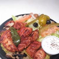 #18 Chicken Shish Kabob Plate · Marinated chicken served on bed of rice, topped with grilled onions, grilled green pepper, s...