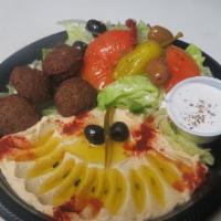 #27 Veggie Plate · 4 pieces of freshly fried falafel, served with 2 slices of pita bread, a salad.