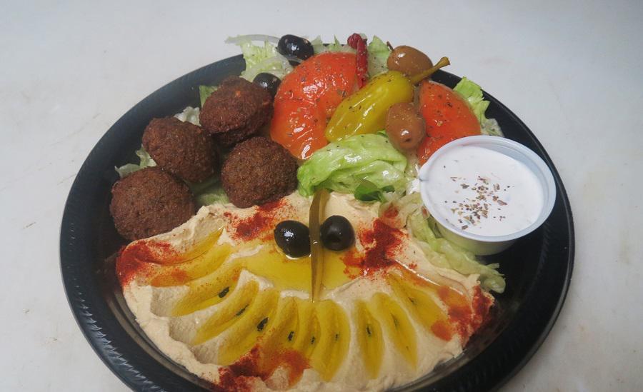 #27 Veggie Plate · 4 pieces of freshly fried falafel, served with 2 slices of pita bread, a salad.